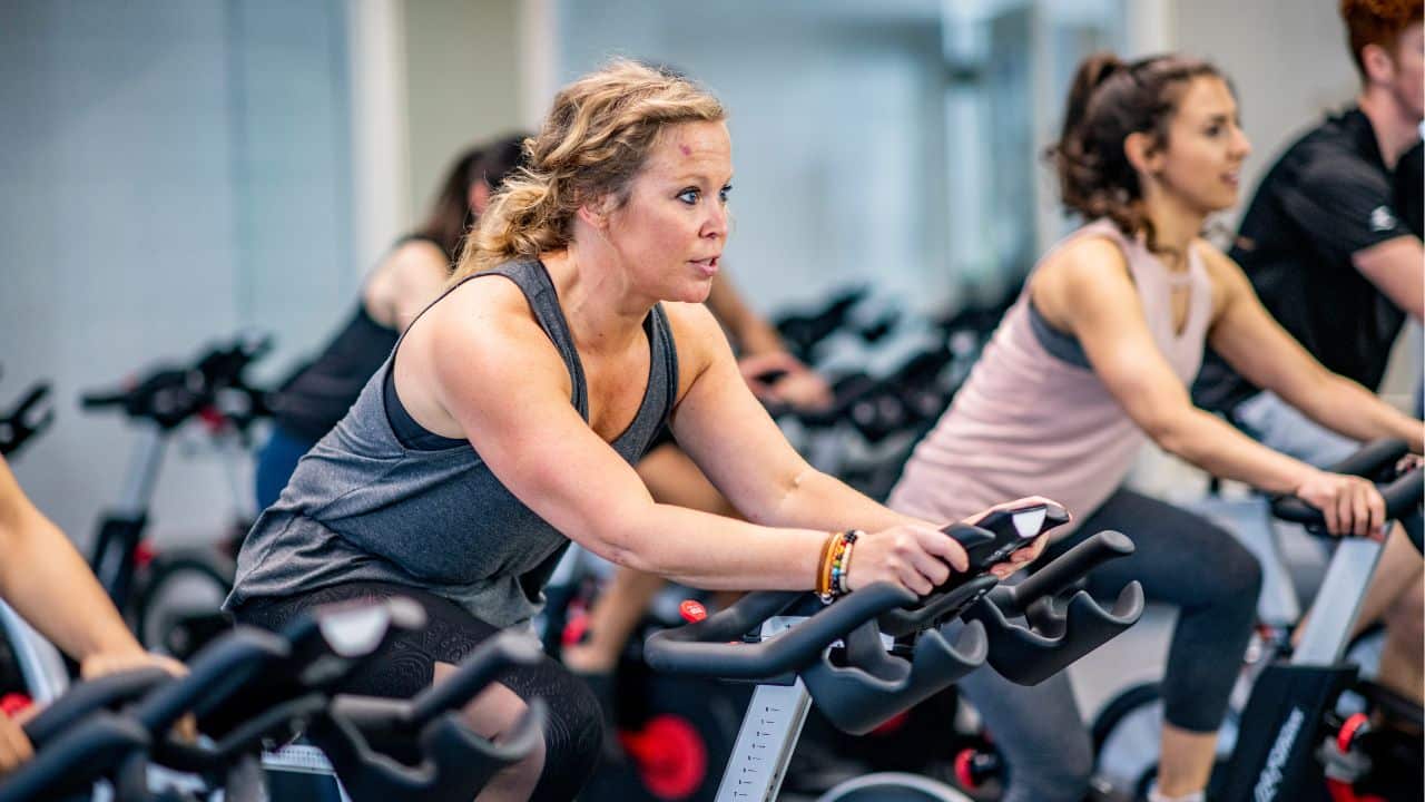 girl working out on the best heavy duty exercise bike