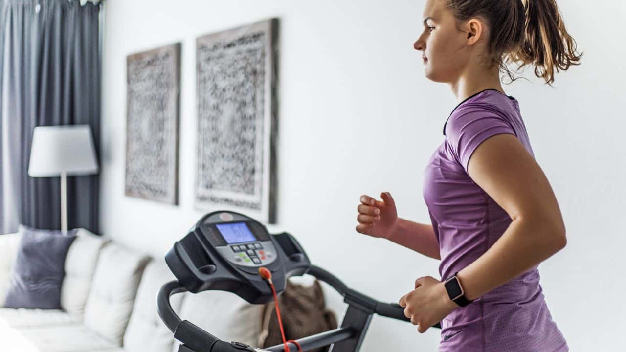 woman running on her best treadmill for apartment