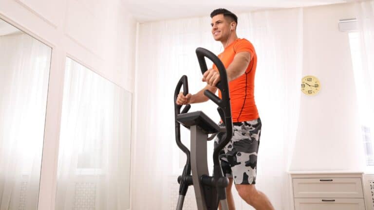 man working out on the best elliptical stepper combo